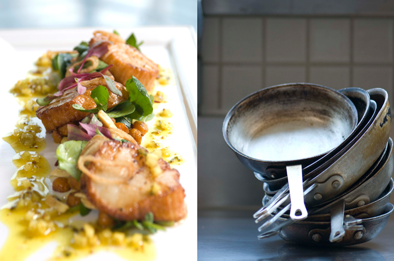 plated food and a stack of frying pans